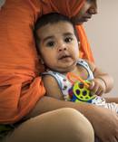 Nishat Abedi holds her son Abdul Fahad Syed, after her husband, Abdul Raheem Fahad Syed, was killed by an alleged drink-driver. Photo / Michael Craig