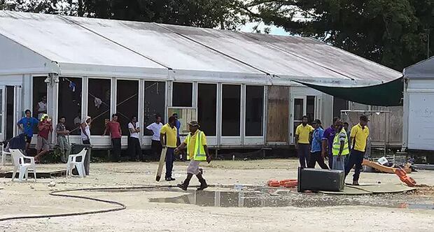 Police and immigration officials destroying water storage containers at the Manus Island immigration detention centre in Papua New Guinea. Photo / AAP