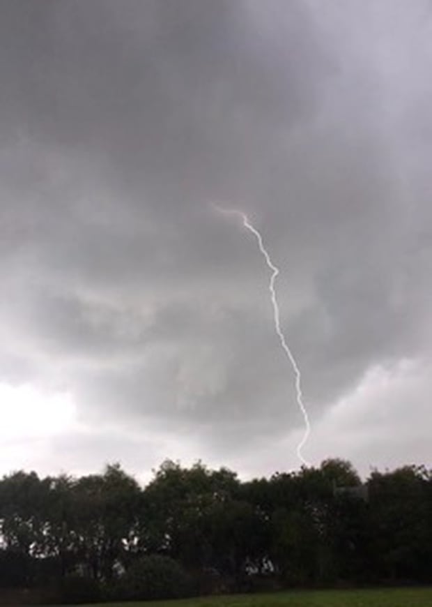 Lightning forks to the ground in Wainui near Orewa. Photo / Emily Johnston