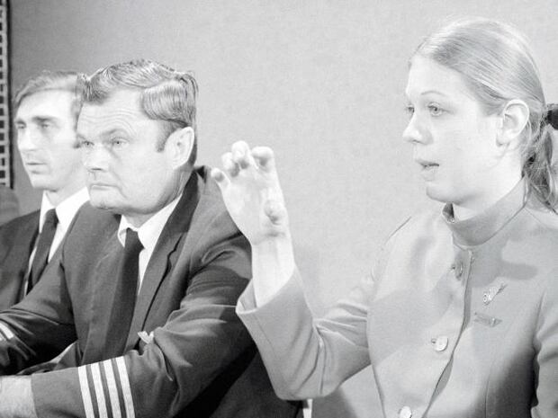 Crew members of the hijacked Northwest Orient Airlines flight explain what happened during a press conference. Photo / News Corp Australia 