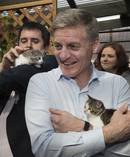 National leader Bill English finds a friend. Photo / Mark Mitchell