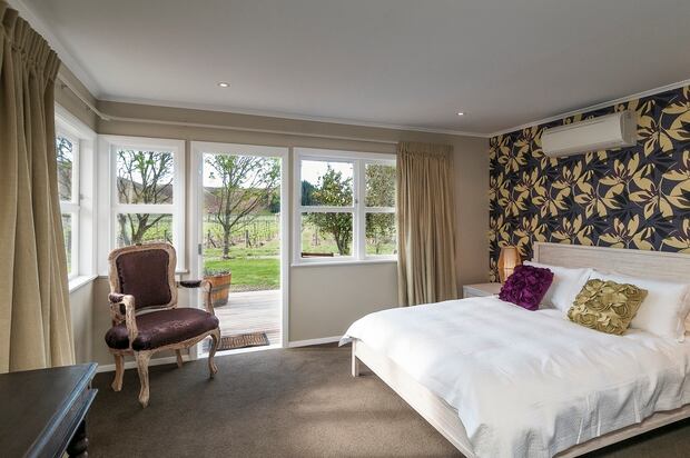 One of the bedrooms at The Farmhouse. Photo / Supplied
