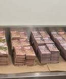 $2.5m in cash and 2kg of meth have been found at a Te Atatu property. Photo / NZ Police