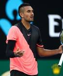 Nick Kyrgios complains about a helicopter flying overhead during his Australian Open clash against Viktor Troicki yesterday. Photo / Getty Images.