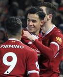 Liverpool's Philippe Coutinho celebrates scoring against Swansea City. Photo / AP