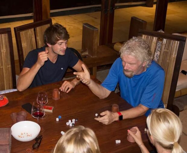 British billionaire Richard Branson enjoys a game of Perudo with staff as Hurricane Irma speeds towards his Necker Island home. Photo: Richard Branson/Virgin 
