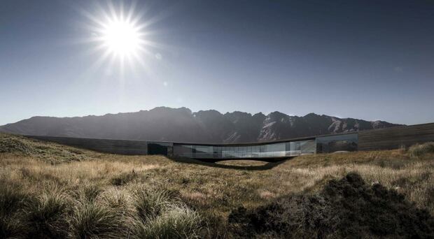 How the house would look mid-summer, surrounded by tussock.