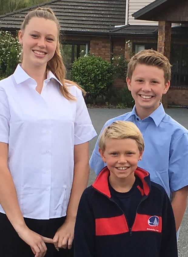 Logan with his sister Olivia,15,and brotherZavier,13.