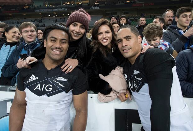 Aaron Smith, right, with his partner Teagan Voykovich, second from right, following an All Blacks test. Also pictured are All Black Julian Savea with his wife Fatima. Photo / Brett Phibbs