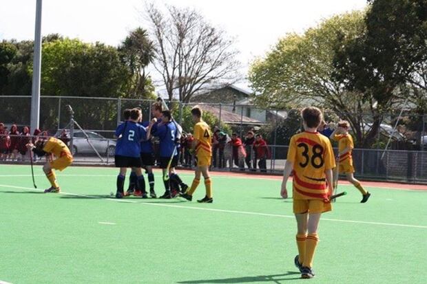 Wanganui players converge after their successful penalty corner goal in the final with Thames Valley.