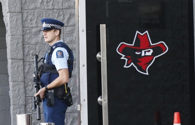 Police search Headhunters HQ in Ellerslie. Armed police at all entries to the building with members of the gang gathering outside. Photo / Nick Reed