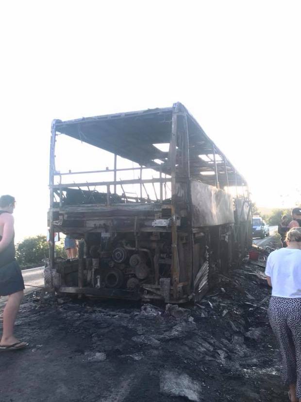 The bus went up in flames as tourists made their way to Anzac Cove. Photo / Laura Smith