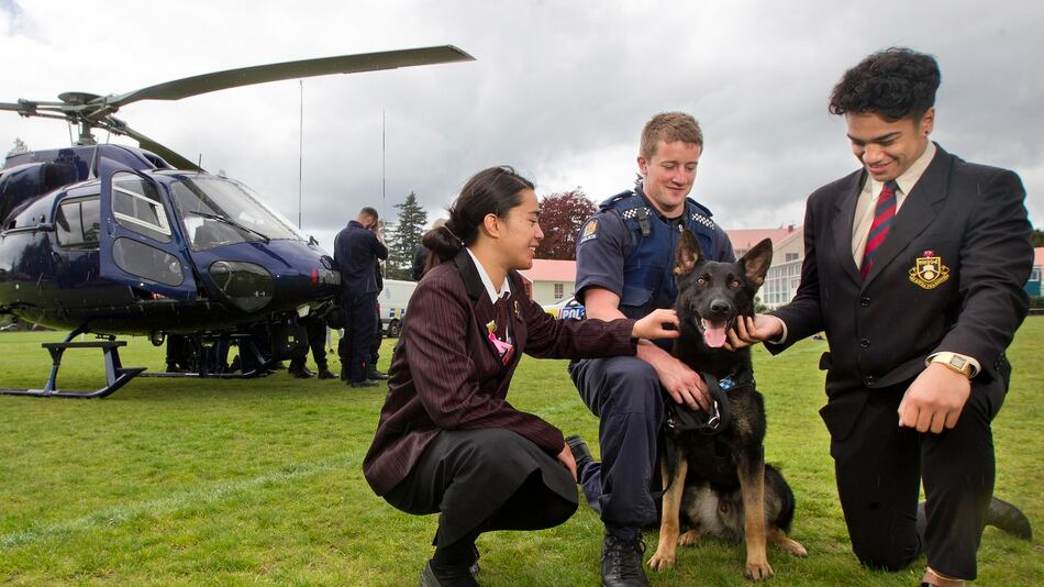 Launch for a new school police studies course at Rotorua Boys' High School. Allannah Tapara, 16, (left) Constable Scott Gosnell, Manny Crawford, 16, and police dog McCaw Photo/Ben Fraser