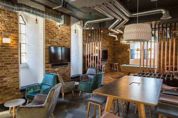 And their kitchen has Televisions, a pool table and an arcade machine.