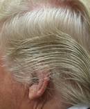The colour of the president's hair, described in the book as an orange-blond, is from Trump not leaving Just For Men in long enough. Photo / Getty Images