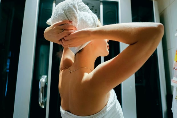 Dr Moore says leaving your hair to dry naturally is more damaging than blow-drying it. Photo / Getty Images. 
