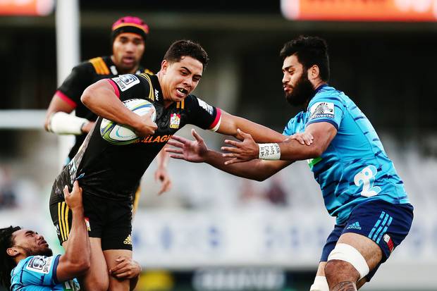 Anton Lienert-Brown of the Chiefs fends against Akira Ioane of the Blues. Photo / Photosport
