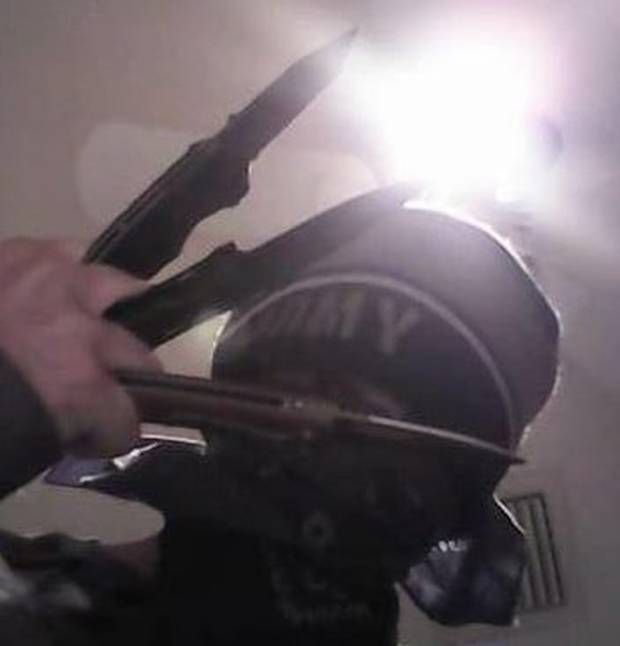 Cruz posing with hunting knives. 