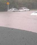 Cars caught in flash flooding on Caribbean Drive, Albany. Photo / Supplied via Keely Brooker