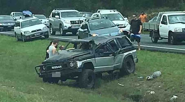 In the footage, shared online on Sunday, more witnesses can be seen to approach the car before they are told off by the woman. Photo / Paul Dossetto / Facebook
