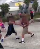 Two men trade punches in the pool carpark. Photo / Supplied