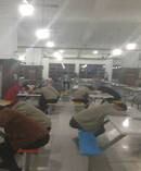 Workers sleep in the cafeteria at Catcher's manufacturing complex in Suqian. Photo/China Labor Watch.