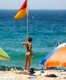 Beachgoers are seen at Tamarama in Sydney. Temperatures rose up to 47 degrees in Penrith today. Photo / AAP