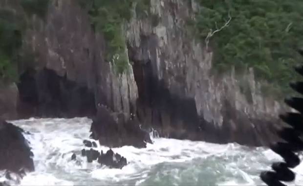 Two men were rescued from this rocky cliff south of Pauanui. Photo / Westpac Rescue Helicopter