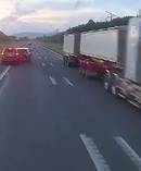 The car crashes into the vehicle in front, as an oncoming truck swerves to avoid disaster.