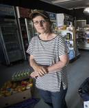 Lynn Yeager, owner of The Pink Shop, begins the task of cleaning up. Photo / Jason Oxenham
