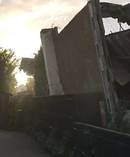 A Pt Chevalier home is damaged after a property being demolished comes crashing down the wrong way. Photo / Supplied