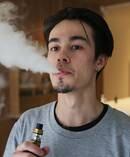 Vapo store manager Mitchell Lowe vaping on an electronic cigarette. Photo / Doug Sherring