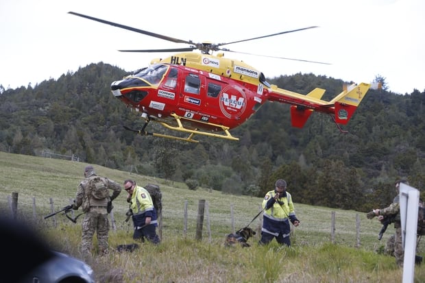 Westpac Rescue Helicopter landed in a paddock near the cordon in Whangarei. Photo / Northern Advocate