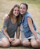 Madeline Anello-Kitzmiller, left, with her friend Kiri-Ann Hatfield, right, had glitter art painted on her chest on New Year's Eve at Rhythm and Vines. Photo / Brett Phibbs
