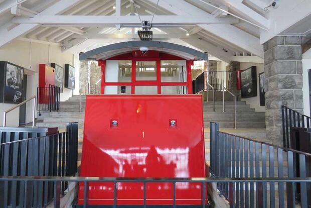 The recently restored funicular takes guests from the ferry up the steep incline to the hotel. Photo / Supplied