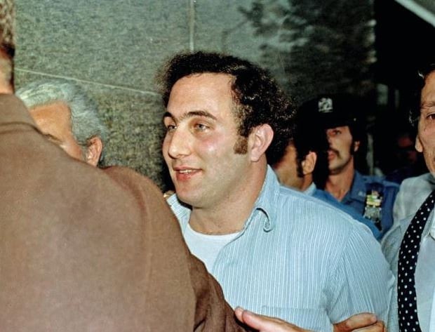 David Berkowitz, the tabloid-loving, police-taunting Son of Sam killer, in the custody of police after his arrest, in New York. Photo / AP 