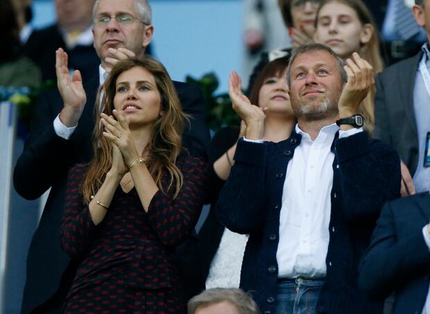 Roman Abramovich and his partner Dasha Zhukova, left, applaud during the Champions League final soccer match. Photo / AP