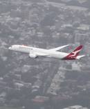 A Qantas Dreamliner over Sydney. Photo / James Morgan