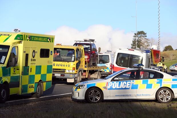 Police, Armed Offenders Squad and ambulance crews attend the shooting at Mount Tiger Rd near Whangarei. Photo / John Stone
