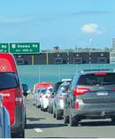 A man climbed on to the overhead signs on Auckland's harbour bridge. Photo / Twitter