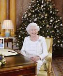 Britain's Queen Elizabeth sits at a desk in the 1844 Room at Buckingham Palace, after recording her Christmas Day broadcast to the Commonwealth. Photo / AP