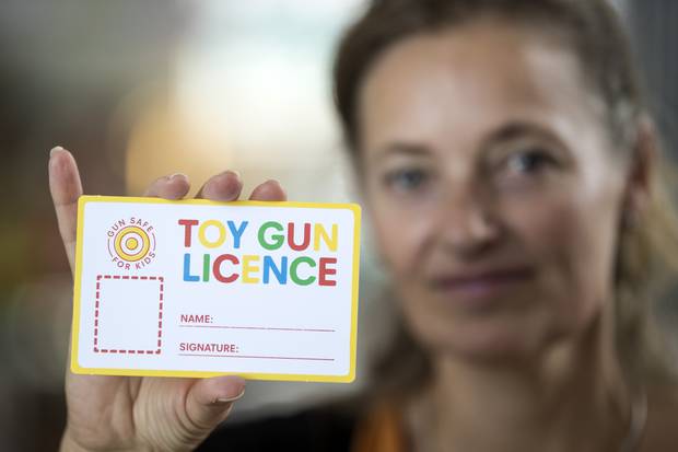 Fay Amaral holds a toy gun licence that will be available to download at preschool centres. Photo / Jason Oxenham