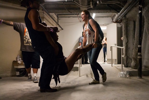People assist a wounded woman at the Tropicana during an active shooter situation on the Las Vegas Strip. Photo / AP