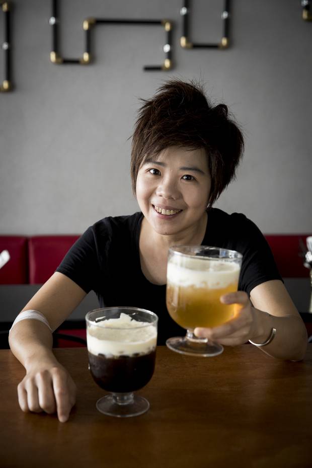 Rounny Lin with their iced tea with cheese drink. Photo / Dean Purcell