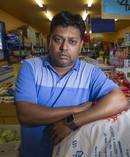 Swansea Island Food Mart owner Rakesh Kumar wants the community to step up after three teenagers pulled knives on him in a robbery. Photo / Paul Taylor