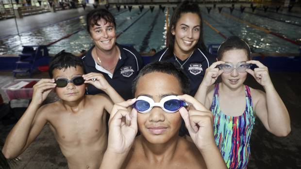 Swim Rotorua juniors and coaches Wesley Larey (11), left, Tara Watt, Seth Green (11), Katlin Donelley, and Zoe Adams (11). Photo / Andrew Warner