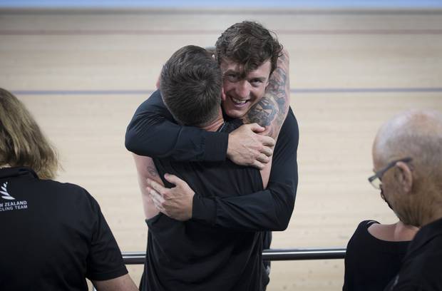 New Zealand Men's Team Sprint member Ethan Mitchell celebrates gold with friends and family. Photo / Greg Bowker