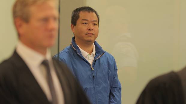 Kang Huang appears at Auckland High Court for sentencing. Photo / Michael Craig