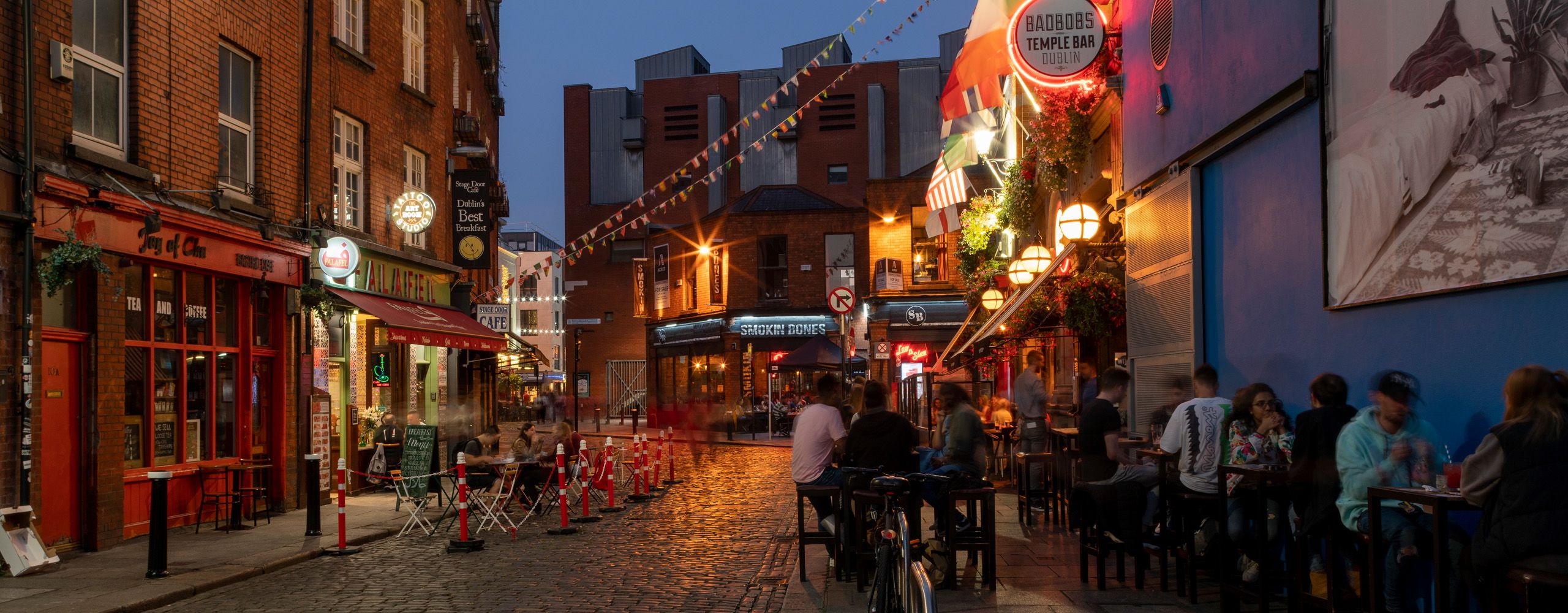 hands formed together with red heart paint