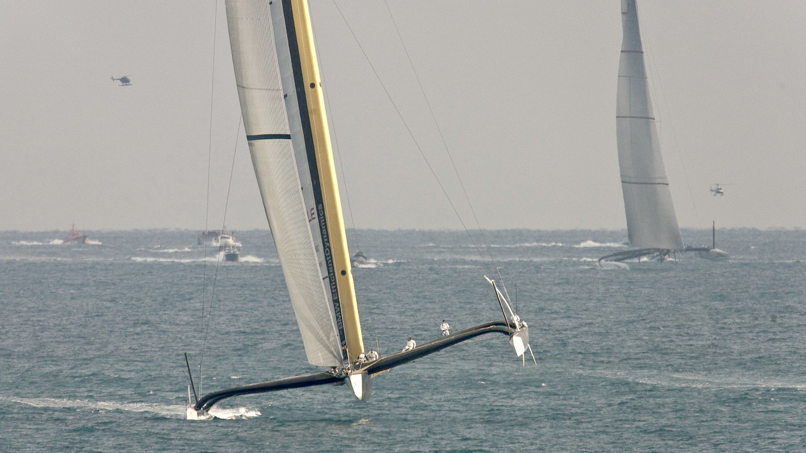 BMW Oracle and Alinghi sail in the special Deed of Gift America's Cup race 1 off the coast of Valencia Spain.